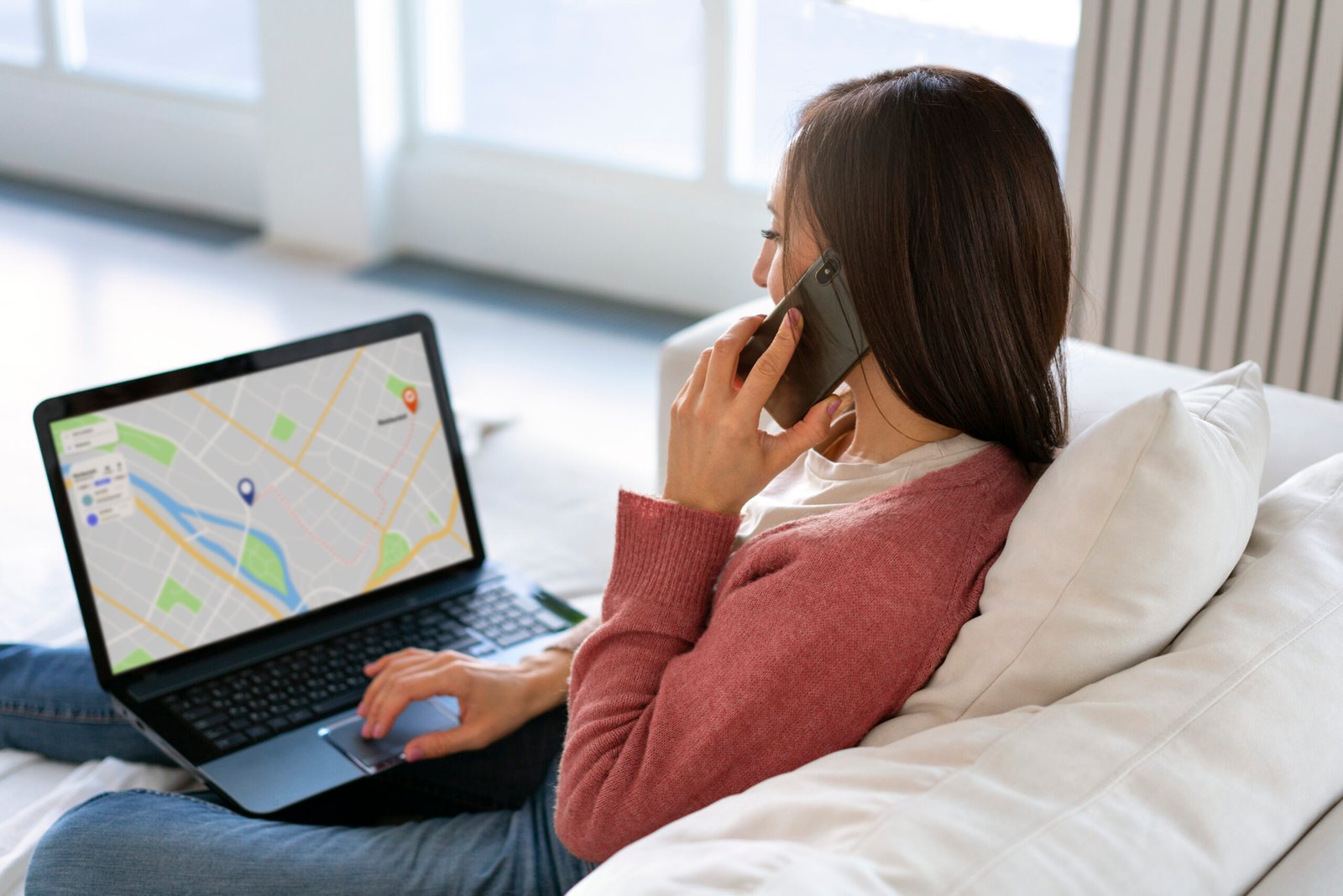 side view woman holding laptop
